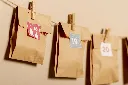paper-style-pouches-hanged-with-hooks-wall.webp